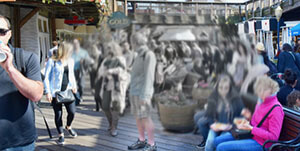 View of a crowed public area with a greyed, blurred central area blending into a colourful edge of vision showing central vision loss due to eye disease .